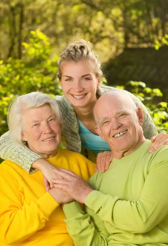 A lady and two elderly couple with matching shirt color