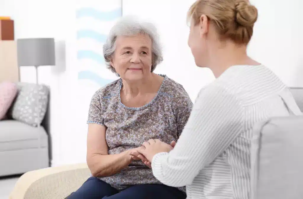Elderly woman having a conversation with her daughter