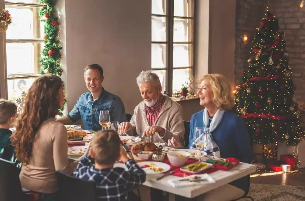 Family gathered around the table to celebrate Christmas