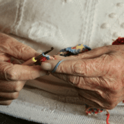 Old person doing a crochet.