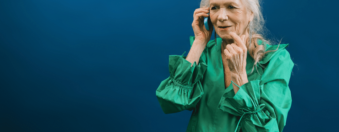 Senior woman talking with someone over the phone.