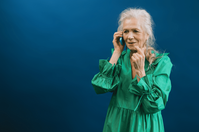 Senior woman talking with someone over the phone.