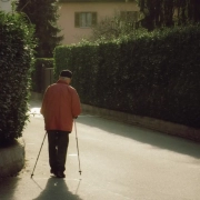 Old man walking in the street.